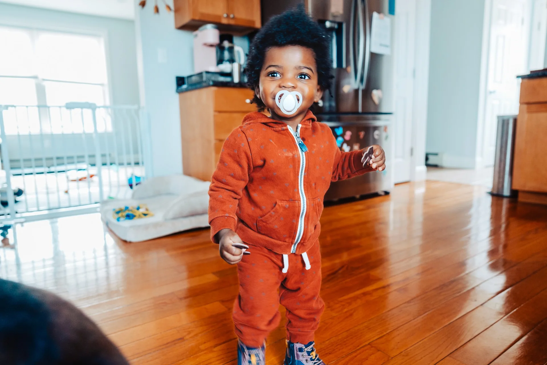 Muyinza’s child smiling at home