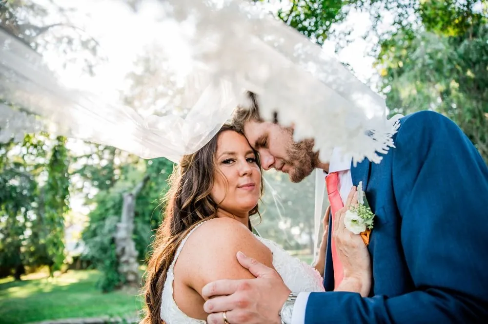 Jennifer looks into the camera as the veil blows over her and Stefan