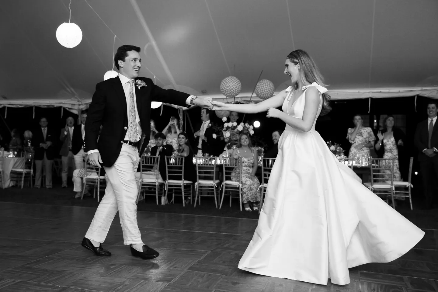 Black and white first dance, Parker spinning Kate as her full skirt swings out