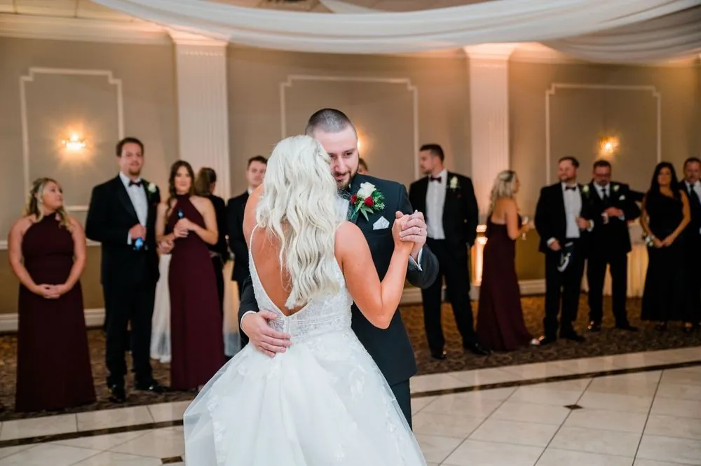 Lexy and Dillon share their first dance as the wedding party circles the floor