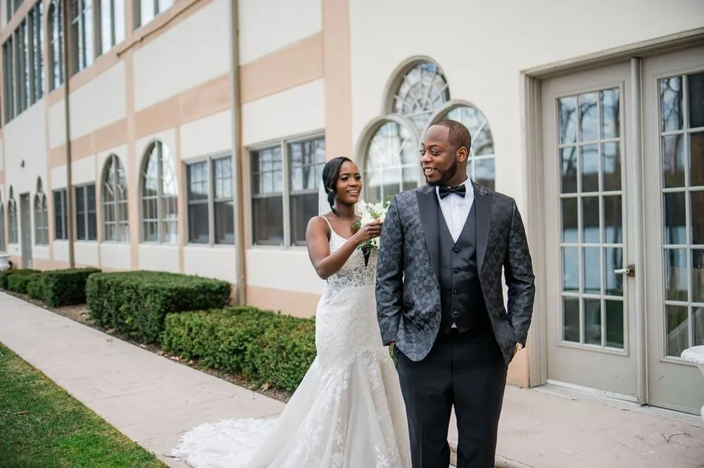 Taria and Franklin share their first look outside along the venue's arched windows