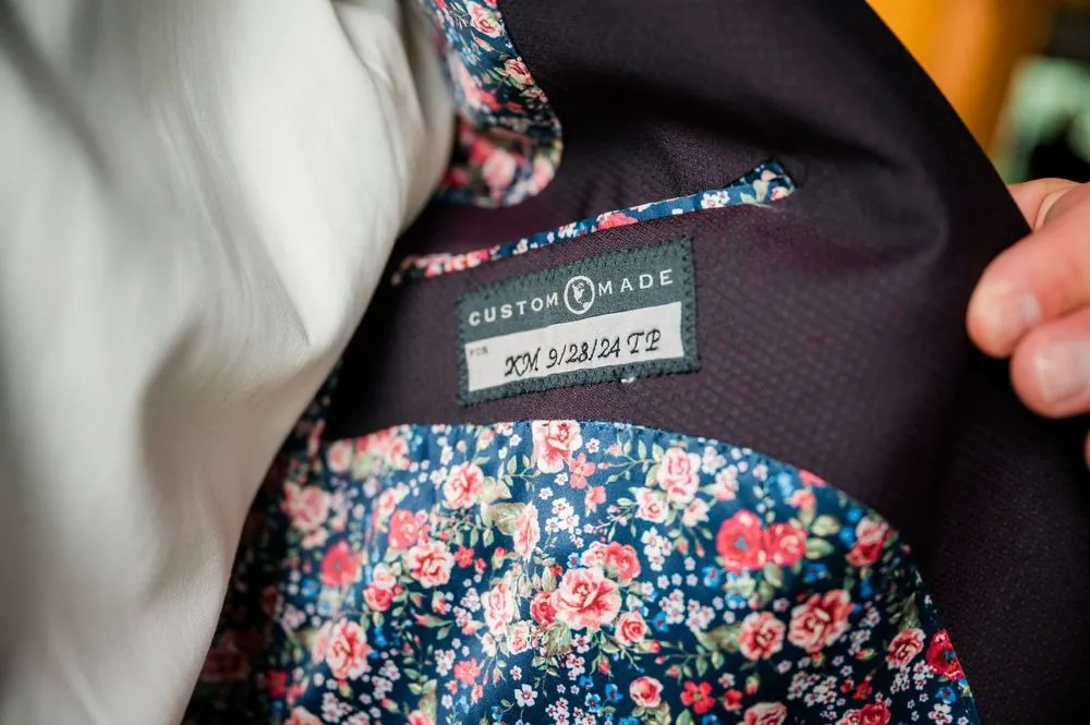 Floral print jacket lining with a custom label inside the groom's suit